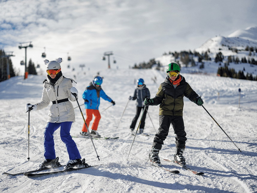 Group skiing on snowy mountain